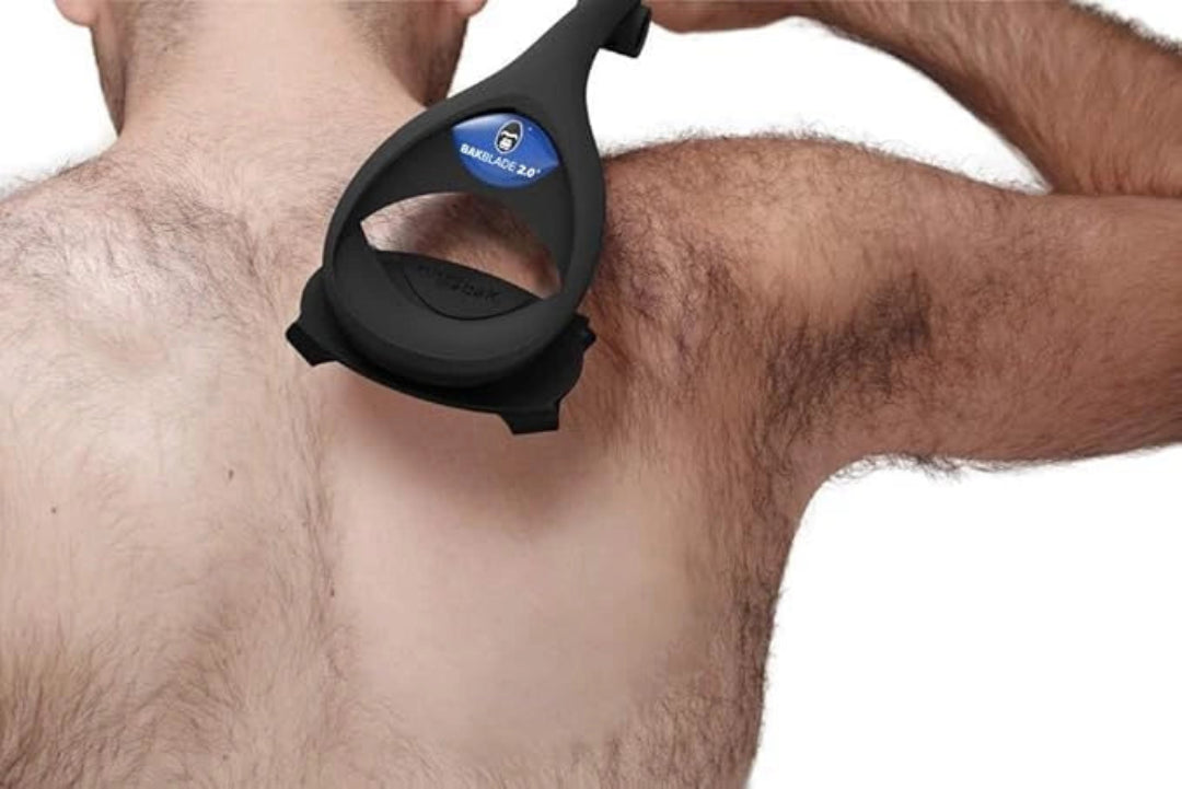 Black hair removal device on a person's chest with a white background
