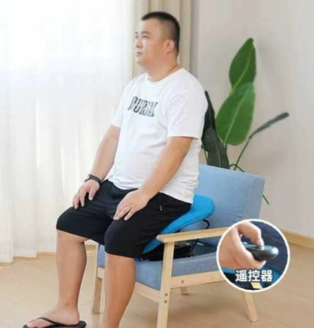 Person sitting on a blue chair with remote control, indoor setting