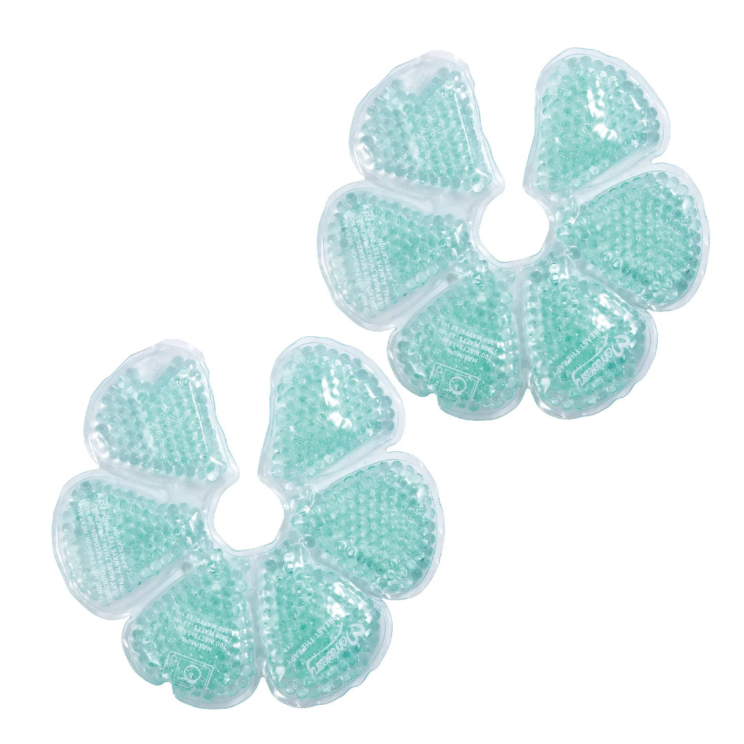 Two green gel packs shaped like flowers on a white background