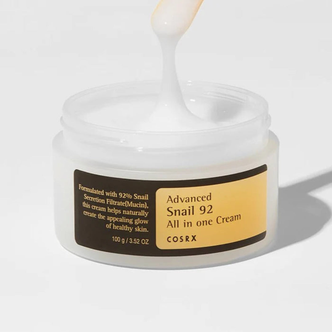 Cosrx Advanced Snail 92 All in one Cream jar with applicator on a white background