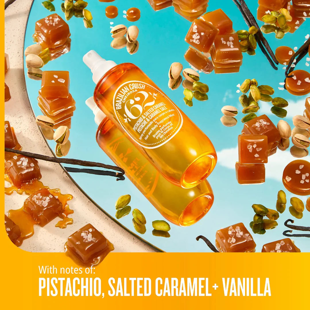 Bottle of Brazilian Crush syrup with caramel cubes, pistachios, and vanilla beans on a blue background.