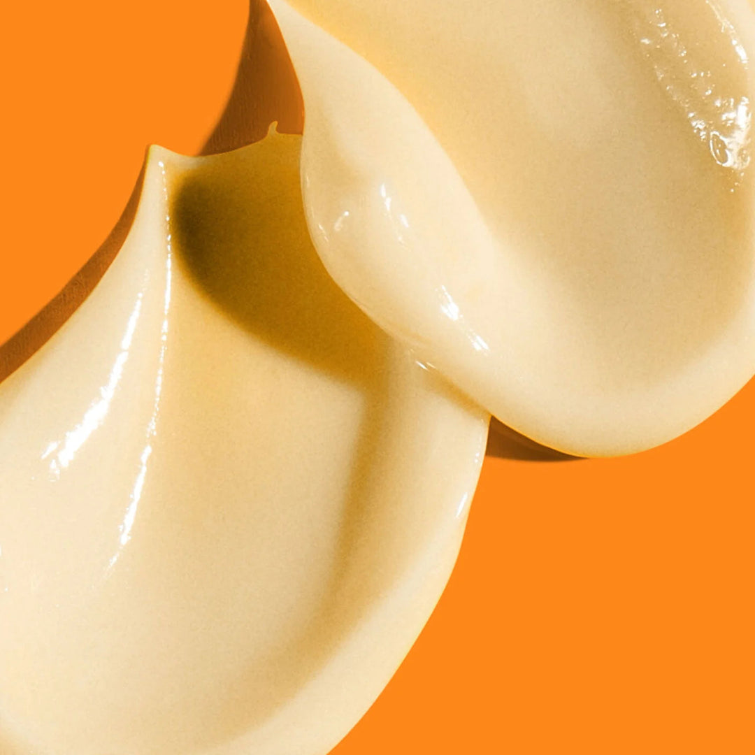 Two white ceramic bowls on an orange background