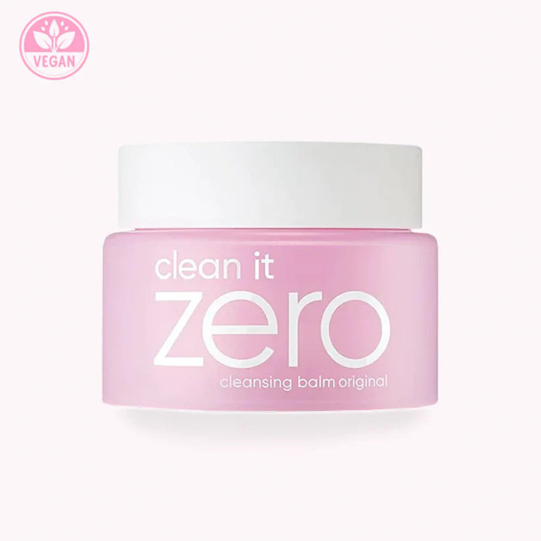 Pink jar of 'clean it zero' cleansing balm with a white lid on a white background.