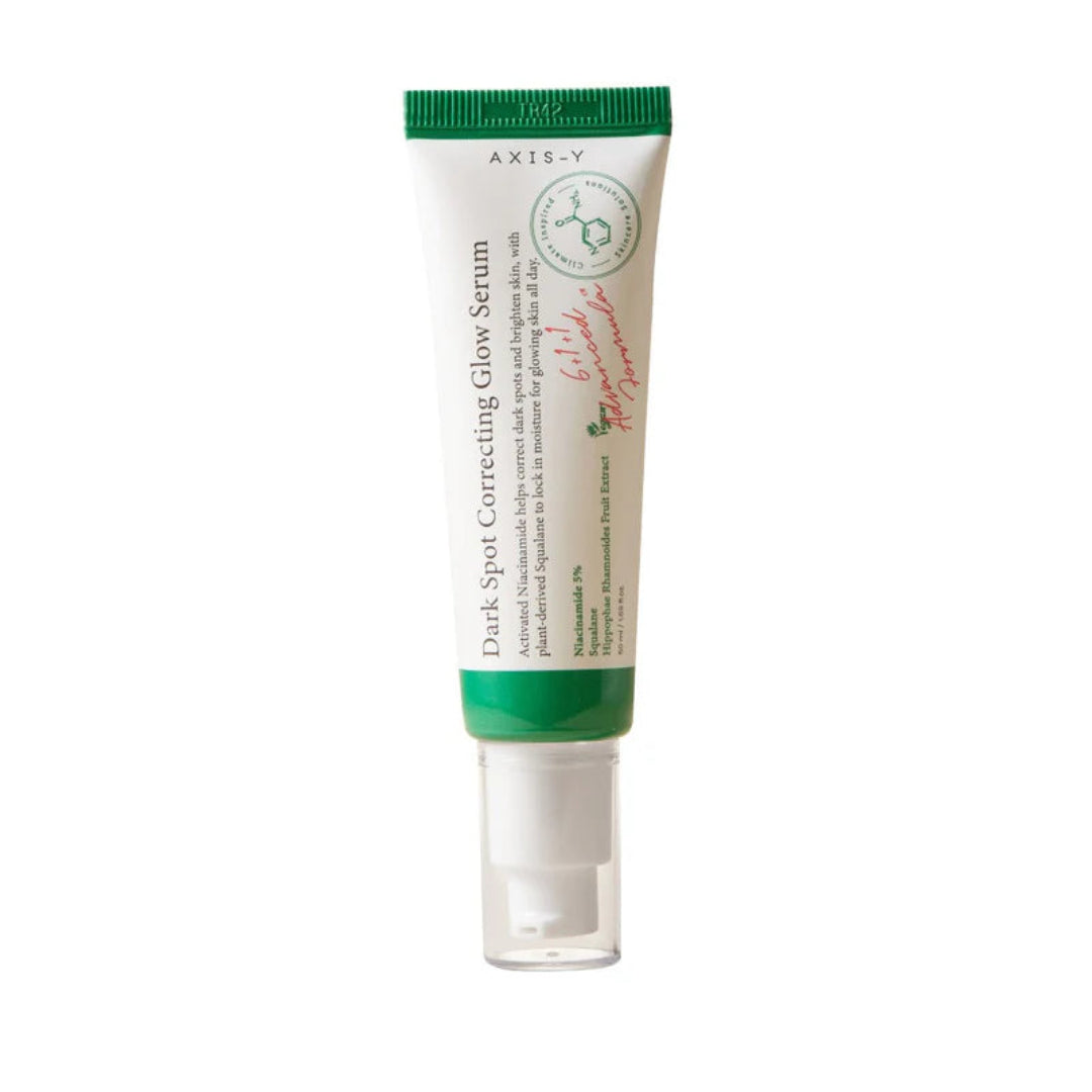 Tube of cosmetic serum with green and white design on a white background