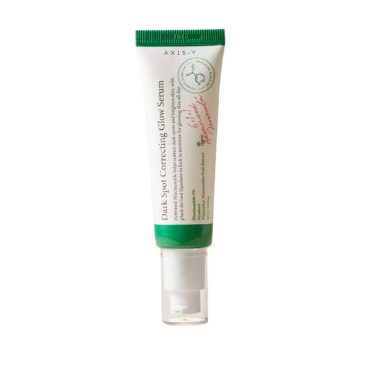Tube of cosmetic serum with green and white design on a white background