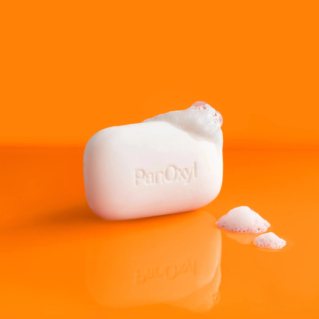 Bar of soap with 'ParOxy' branding on an orange background