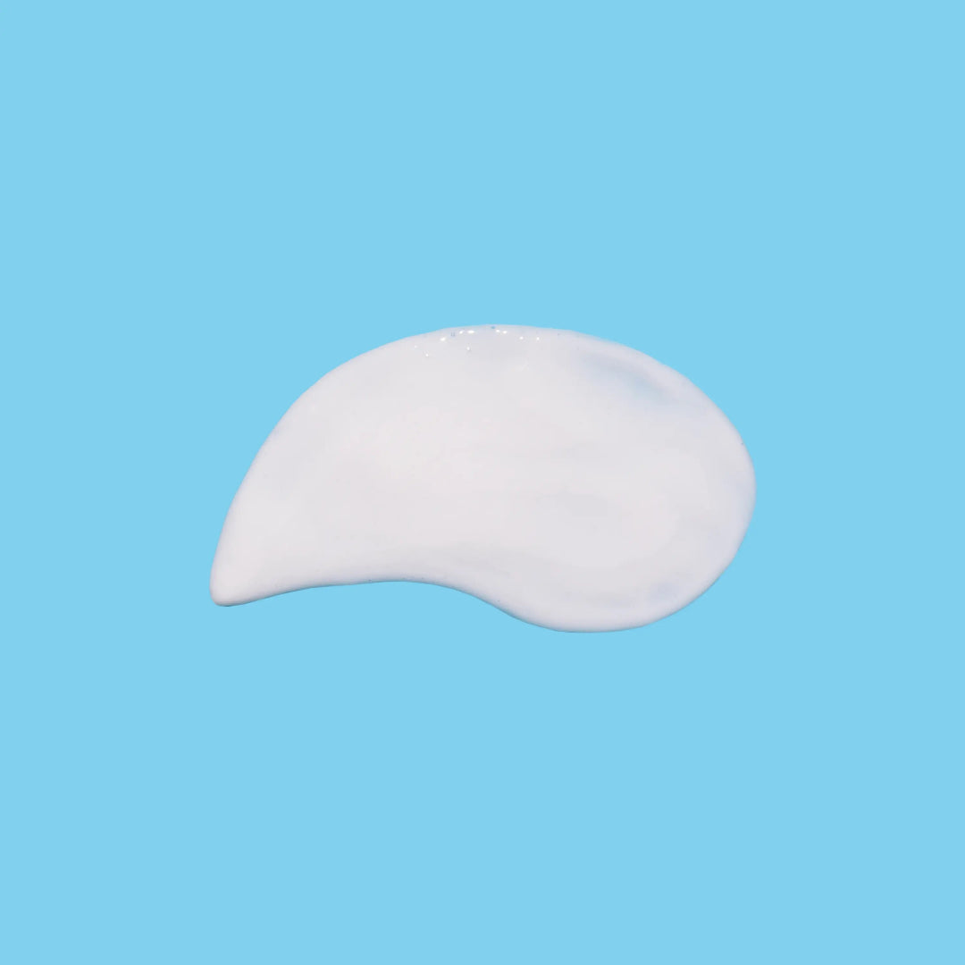 White cream or gel on a blue background