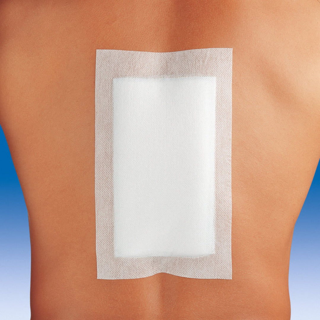 Rectangular adhesive patch on a person's skin with a blue gradient background