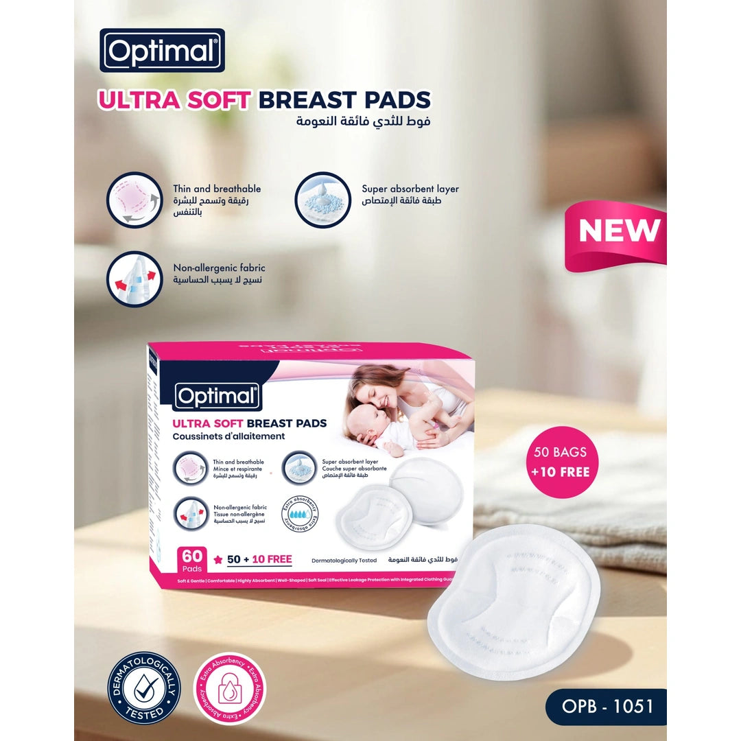 Optimal Ultra Soft Breast Pads packaging and product display on a light beige background, featuring a pink and white box, a loose white breast pad, and promotional text including 'NEW' and '50 BAGS + 10 FREE'.