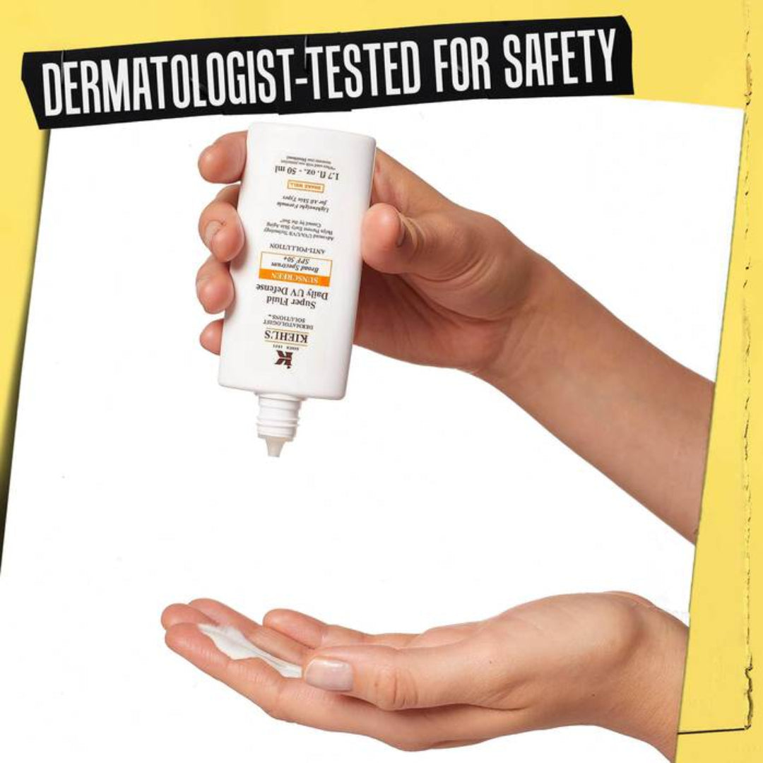 Hand holding a tube of sunscreen with 'Dermatologist-Tested for Safety' text above.